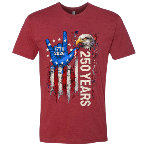 A Cardinal Red t-shirt with a patriotic design of a vertical American flag with red and white horizontal stripes, with a blue ASL "I Love You" signing hand with a circle of stars.  Inside the stars is written "1776 2026".  The text design says "250 Years" in white.