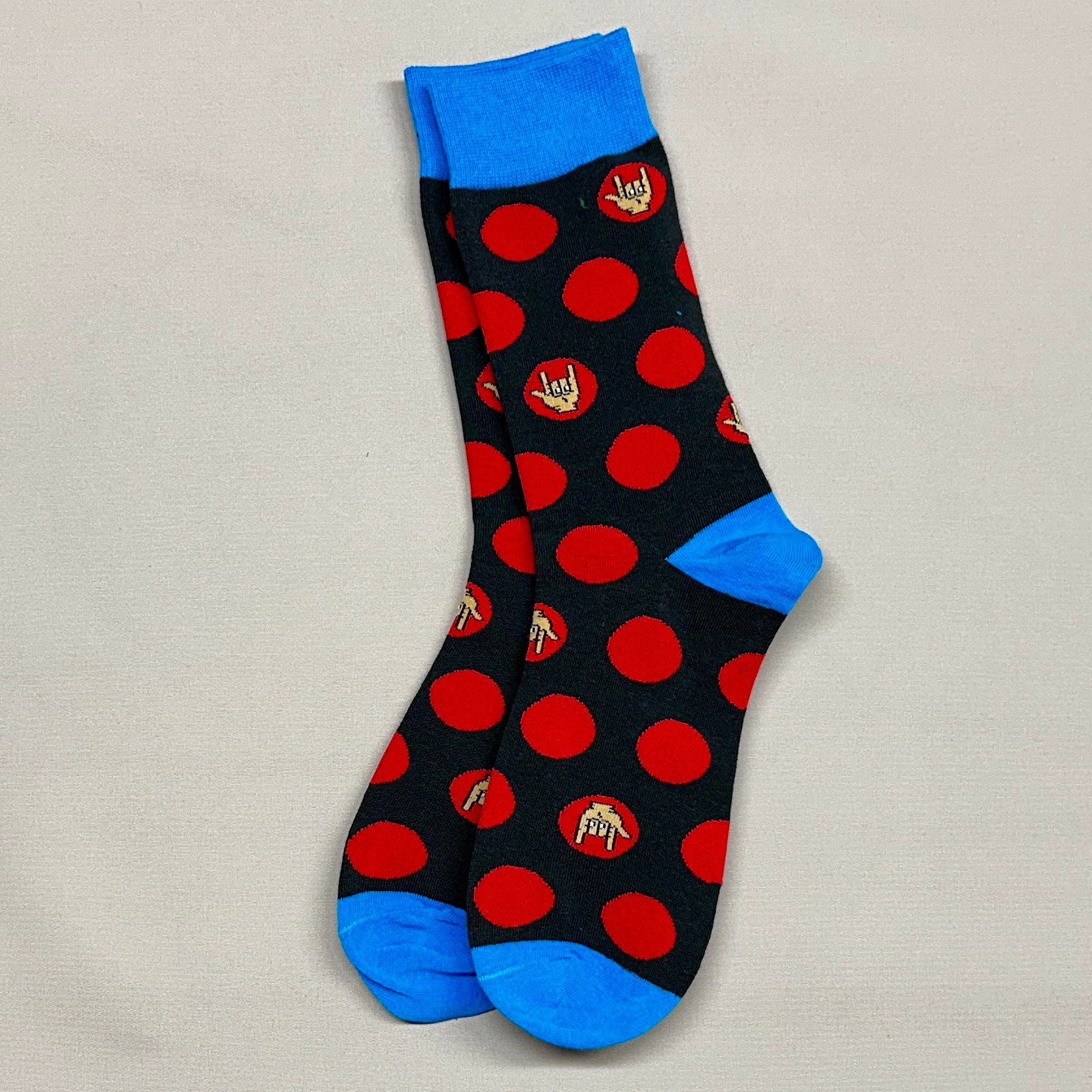 Black socks with red polka dots, blue heel, cuff, and toe