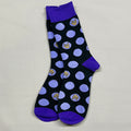 Black socks with purple dots and small logos on a light gray background